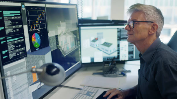 man staring a cad on computer screen